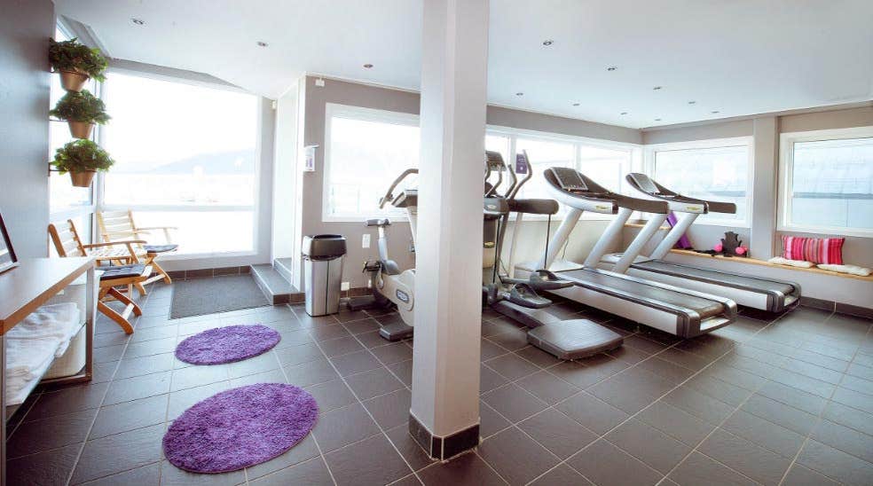 Modern gym with a view at Aurora Hotel in Tromso