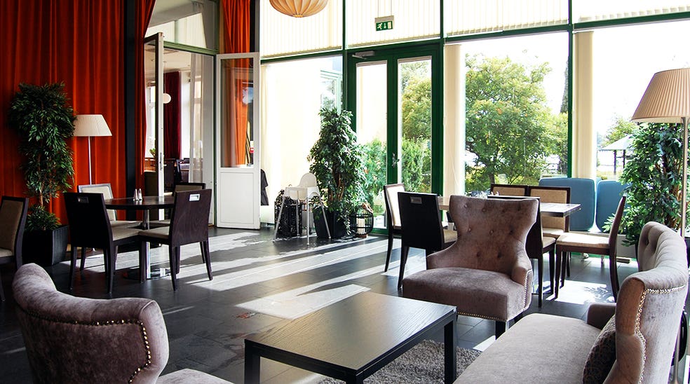 Dining room and lounge with chairs and overview at Clarion Collection Hotel Bolinder Munktell Eskilstuna