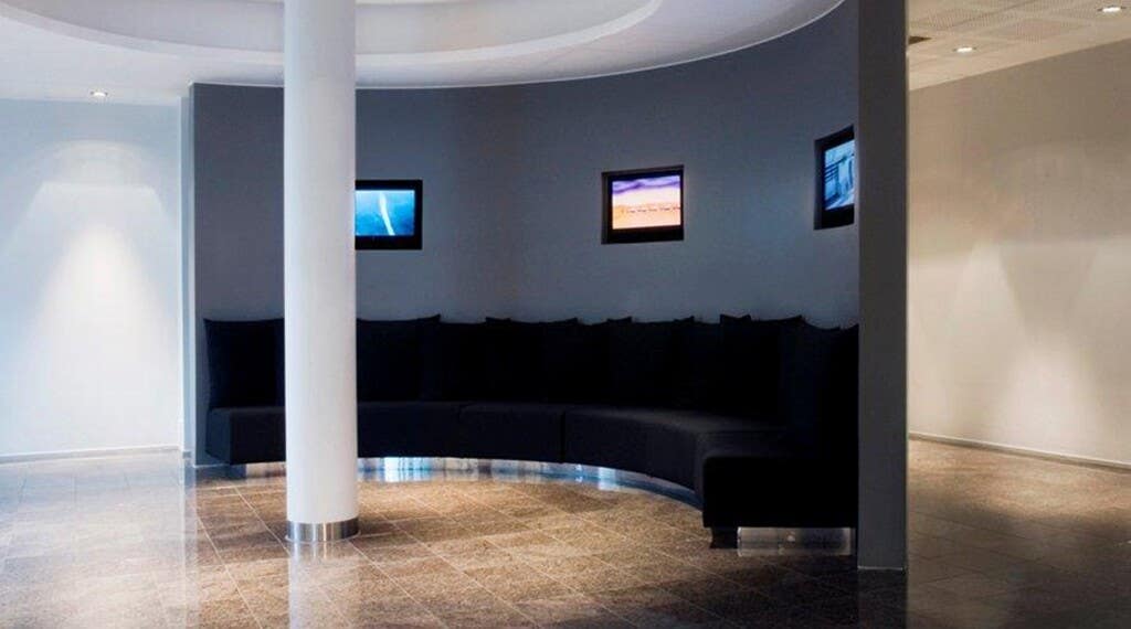 Large common area with comfortable furniture at Bergen Airport Hotel in Bergen