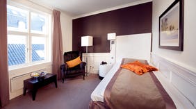 Large standard single hotel room at Atlantic Hotel in Sandefjord