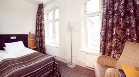 Bright and spacious standard single hotel room at Bilan Hotel in Karlstad
