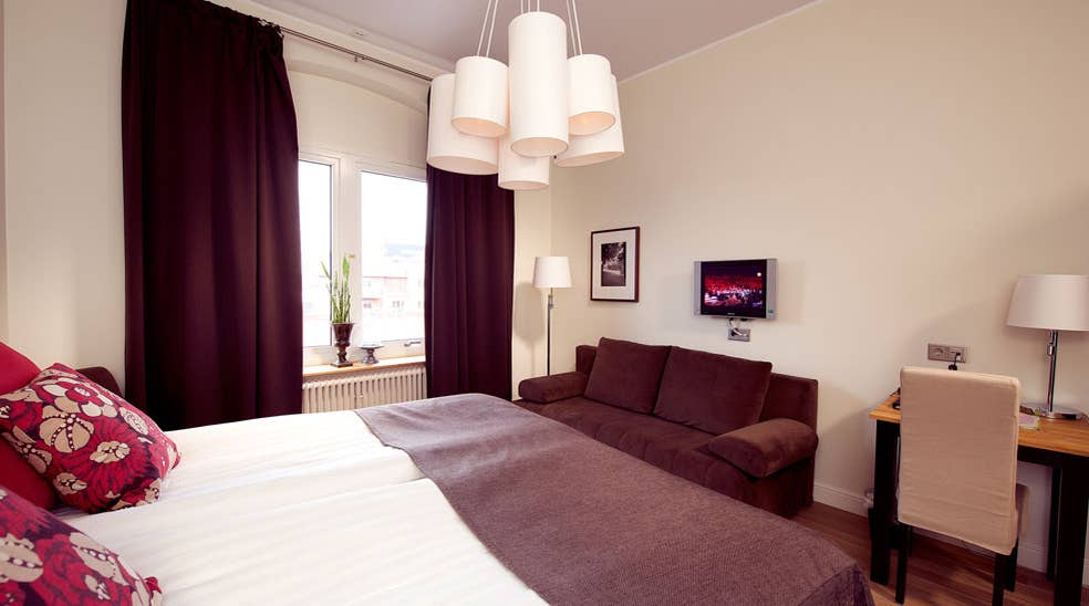 Well-furnished double superior room with a desk and sofa at Norre Park Hotel in Halmstad