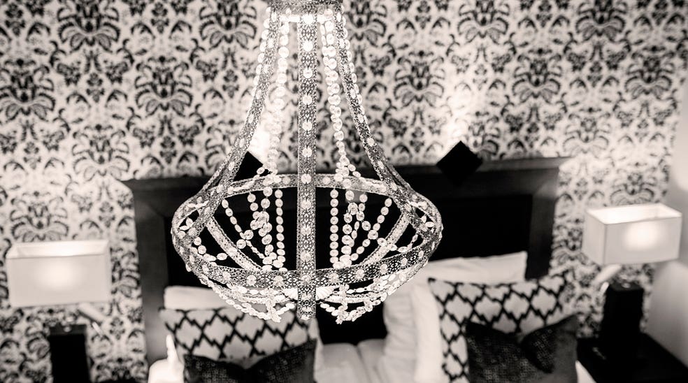 A hip and fashionable chandelier is one of many beautiful interior details at Grand Hotel Helsingborg 
