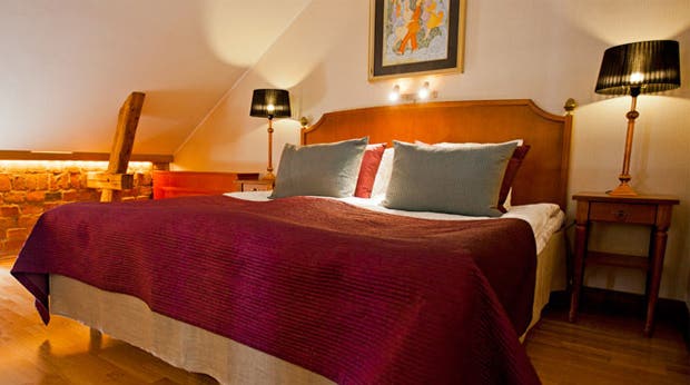 Elegant first-class suite bedroom at Hotel Orebro