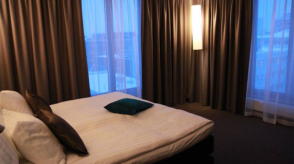 Elegant suite bedroom with an amazing view at Sense Hotel in Lulea