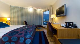 Spacious and well-furnished standard hotel room at Tyholmen Hotel in Arendal