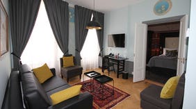 Spacious and well-furnished suite living room at Wisby Hotel in Visby