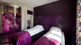 Well-designed colourful superior twin room at Oleana Hotel in Bergen